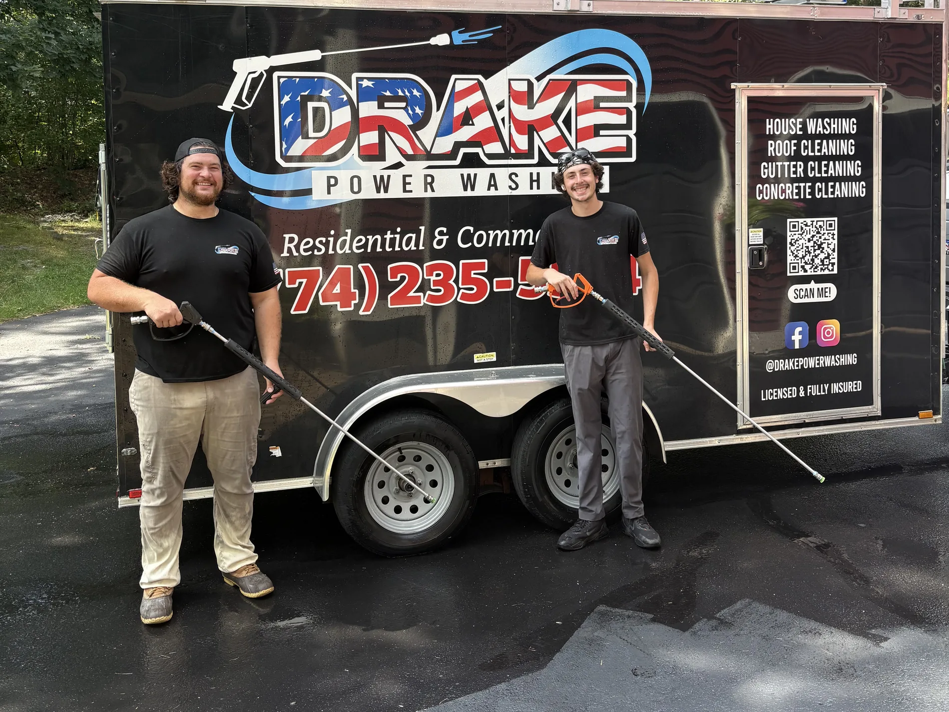 The Drake Power Washing team with their pressure-washing equipment beside their branded trailer
